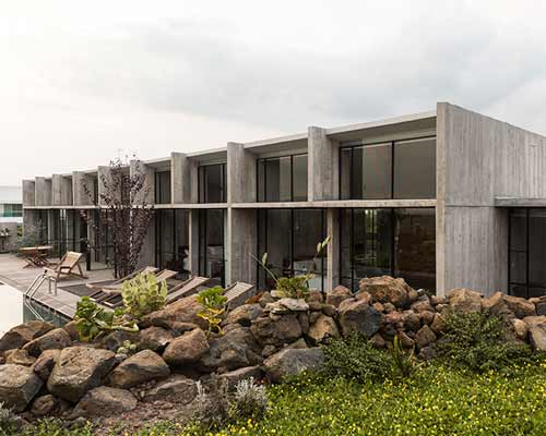AT house by laurent herbiet in mexico is a perfect combination of concrete and glass