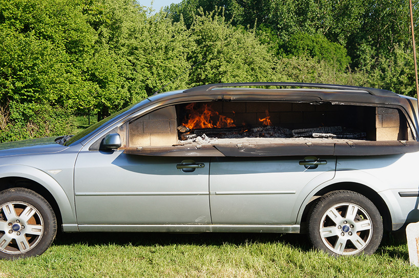 this old car was turned into a wood-burning pizza oven