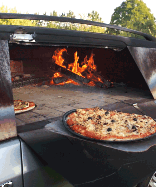 this old car was turned into a wood-burning pizza oven