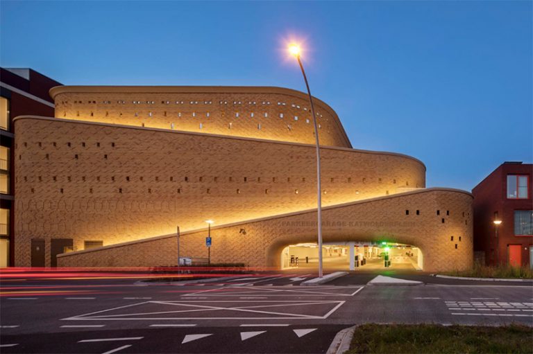 eastern hues and patterns adorn the brick facade of this car park by ...
