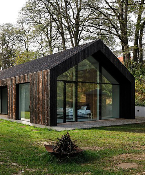 one-story family house in czech republic by ateliér kunc is covered with charred larch