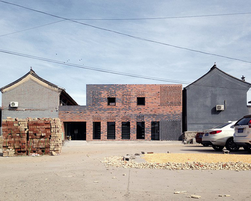 frédéric schnee creates patterns of different-colored bricks for the peach house in beijing