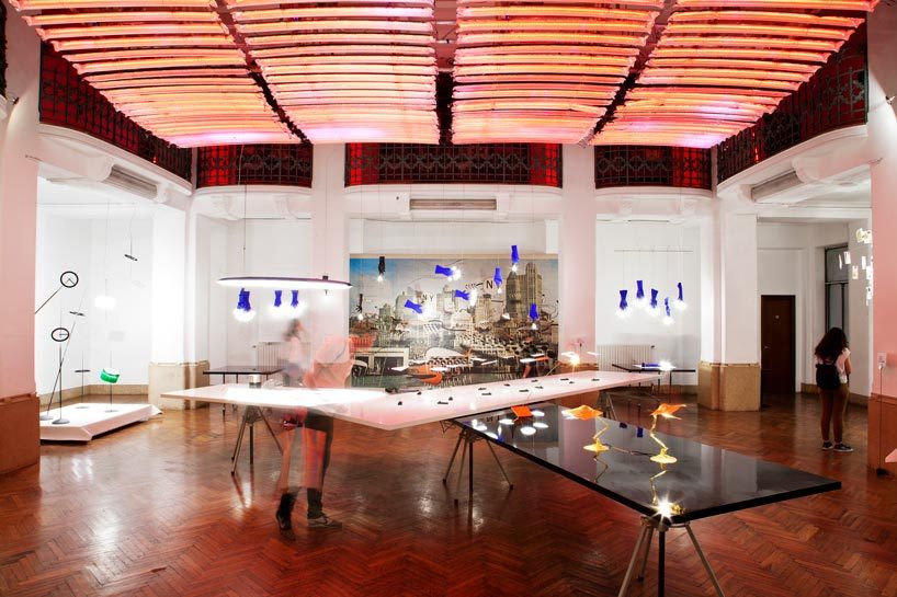 ingo maurer's luzy lights illuminate the fingertips of plastic gloves