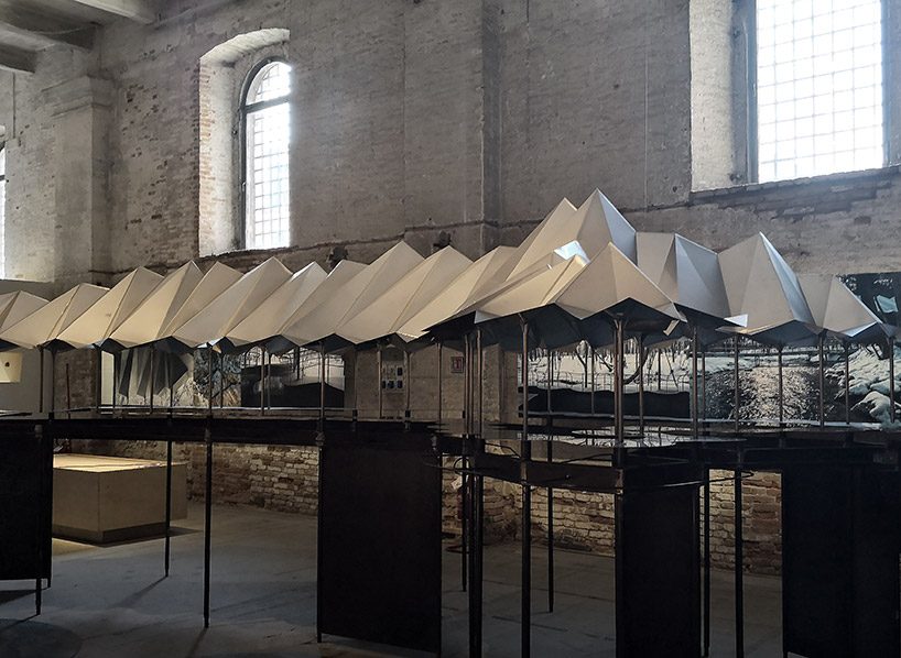 jensen & skodvin's protective roof over moya spring water source at venice biennale