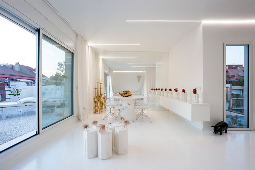 marco de gregorio refurbishes barcelona apartment using an all white palette