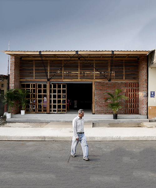 natura futura's 'the house of prayer' has a permeable façade made of wooden mesh