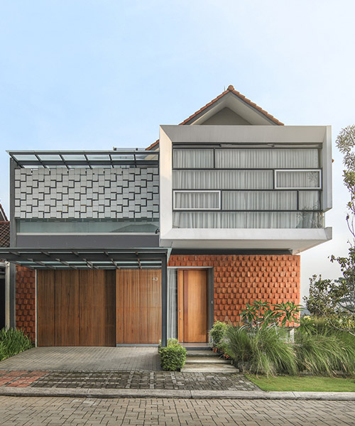 RN house by indonesian rakta studio has a pulled out white box with floor to ceiling window