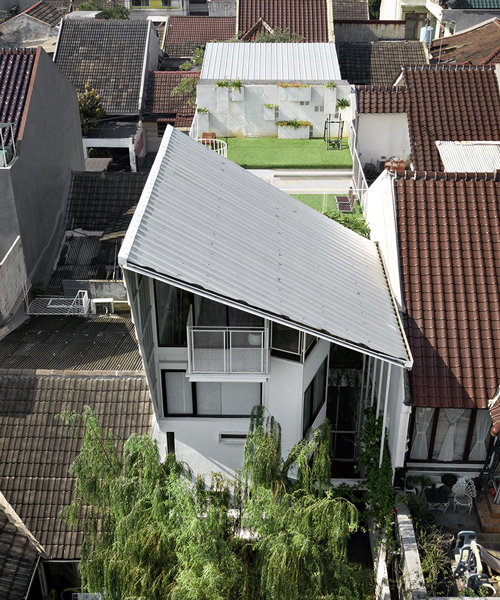 living, work and social spaces merge into a growing house in indonesia, by SA_e