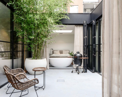 standard studio renovates old canal house in amsterdam into an open but private loft