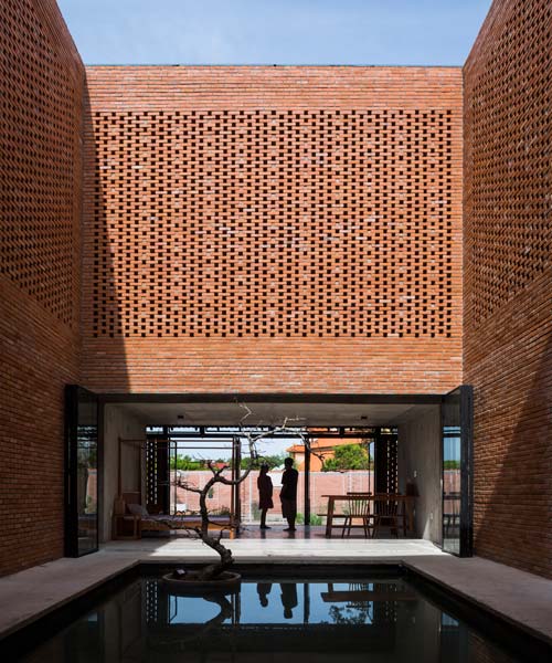 'long an house' in vietnam is a creative brick residence by tropical space