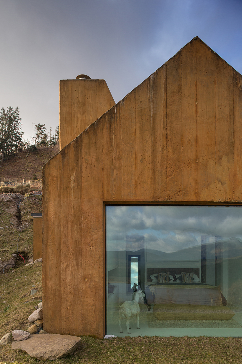 urban agency's rustic house is sheds covered with rusted metal