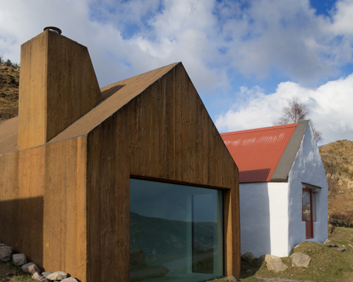 urban agency's rustic house is sheds covered with rusted metal