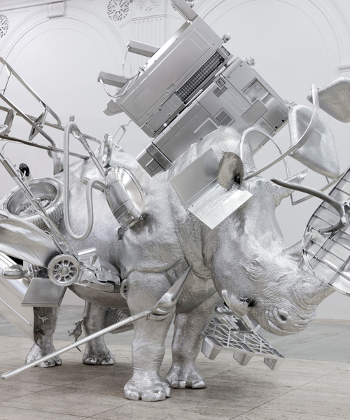 urs fischer creates a life-size rhinoceros sculpture surrounded by a constellation of 'things'