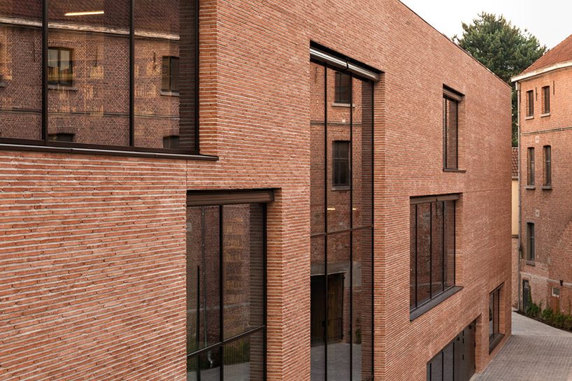 KAAN architecten completes 'utopia', a library and academy for performing arts in belgium