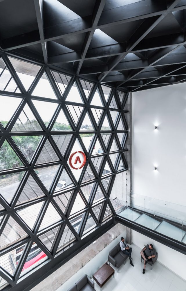 PLASTIK's mexican agency honors the company logo with its triangular pattern facade