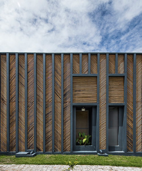 vilela florez arranges bamboo in a herringbone pattern for the facade of this brazilian residence