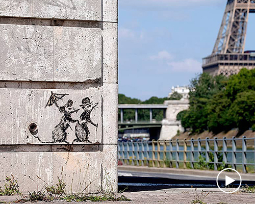 banksy confirms authorship of several new murals across paris that take aim at migration crisis