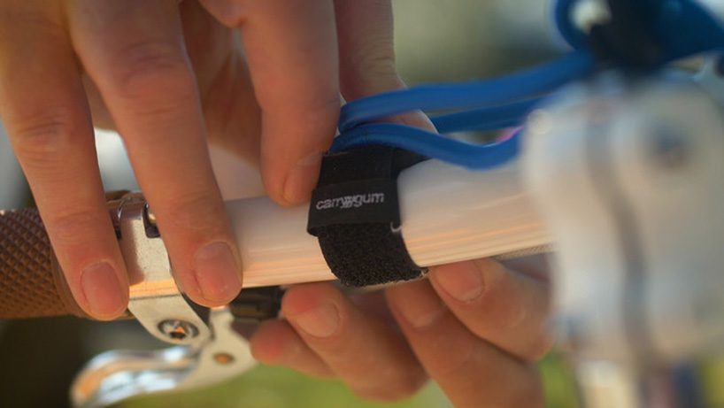 the world's smallest bicycle rack is an elastic strap that carries even the bulkiest of items