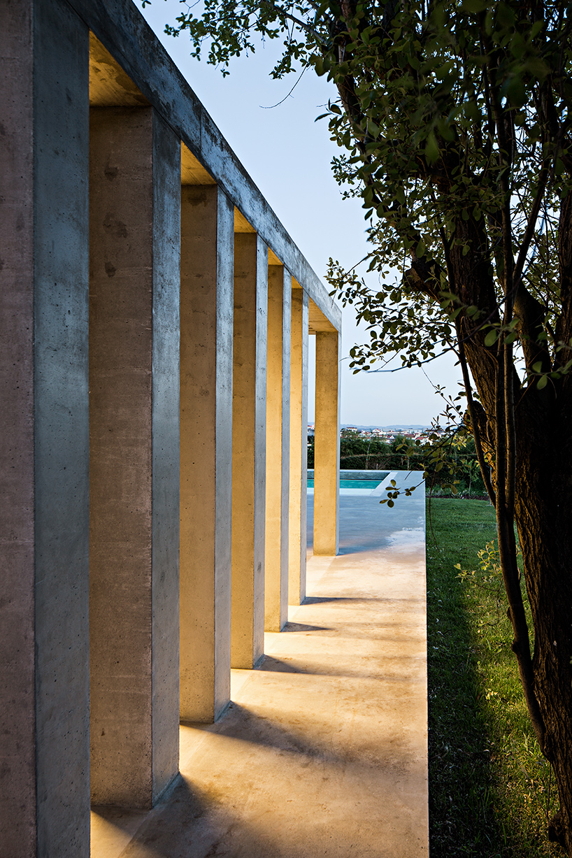 camarim arquitectos designs a pool with the essence of an ancient temple