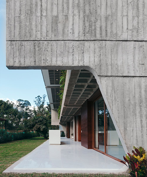 felipe escudero's casa roca in ecuador features curved concrete walls to hug the interior