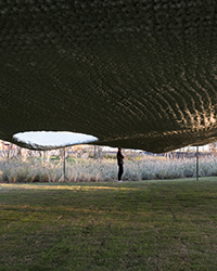 the undulating 'soft matter' pavilion takes inspiration from its site's unnatural geology