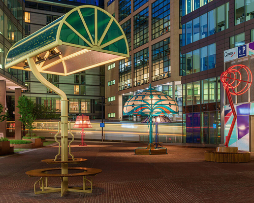 oversized versions of five classic lamps illuminate a manchester square