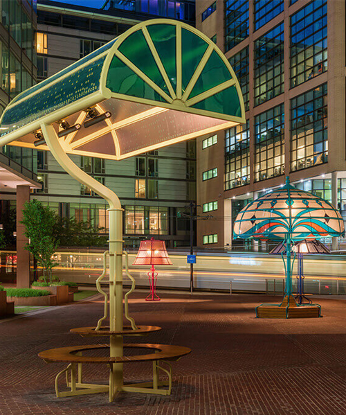 oversized versions of five classic lamps illuminate a manchester square