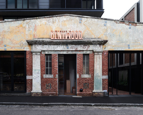 red brickwork in melbourne's bentwood cafe reflects the industrial heritage of its surroundings