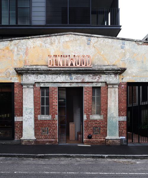 red brickwork in melbourne's bentwood cafe reflects the industrial heritage of its surroundings