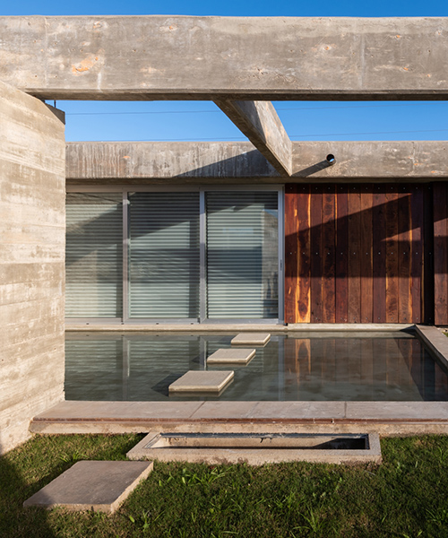 casa CG by adolfo mondejar of argentina is a composition of concrete, wood, and water
