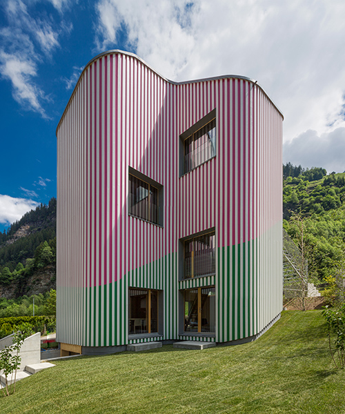 colorful swiss house rossa expresses a playfully artful structure in the calanca valley