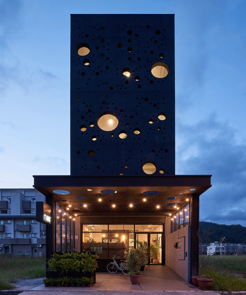 emerge architects' sea foam-inspired guesthouse in taiwan attracts passersby at night