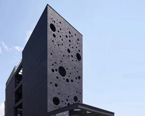 emerge architects' sea foam-inspired guesthouse in taiwan attracts passersby at night