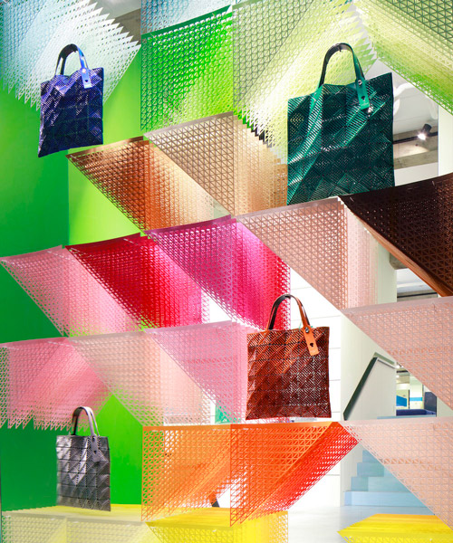 emmanuelle moureaux sets a colorful rainbow moiré installation in issey miyake's stores worldwide