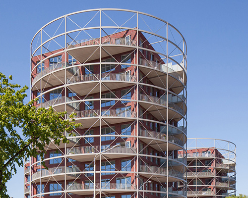mecanoo's 'villa industria' masterplan includes residential towers that resemble gasometers
