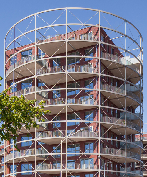 mecanoo's 'villa industria' masterplan includes residential towers that resemble gasometers