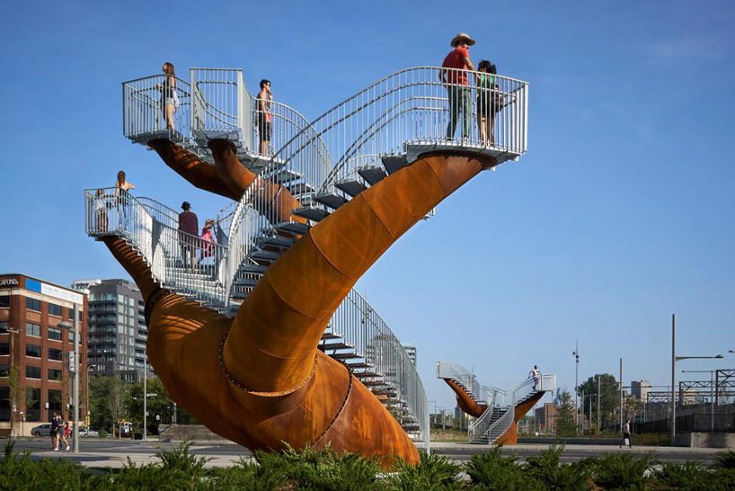 michel de broin's public sculptures emerge from the ground like giant tree trunks