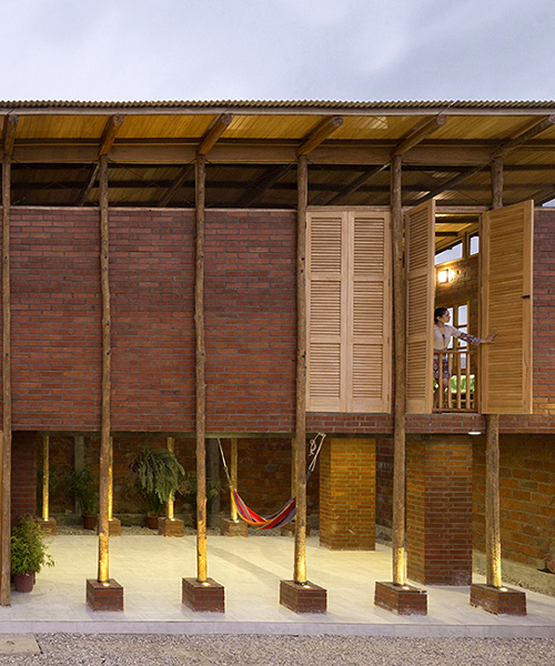 natura futura designs ecuador house with glass-less windows and baked bricks
