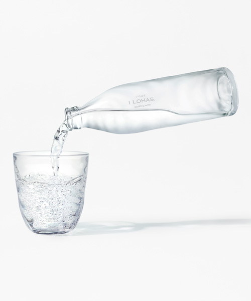 nendo creates glass bottle capturing the ripples of natural spring water
