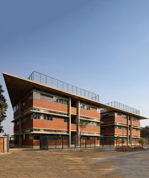 shaily gupta's school in india features brick blocks connected by a floating concrete roof