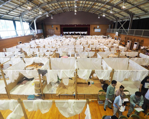 shigeru ban creates temporary shelter system for victims of japanese floods