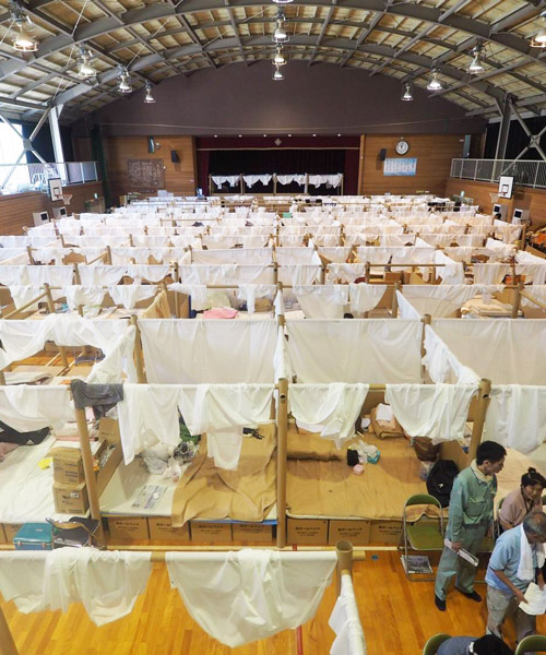 shigeru ban creates temporary shelter system for victims of japanese floods