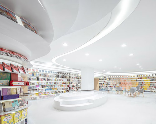 wutopia lab sets a white curved bookstore in xi'an, china