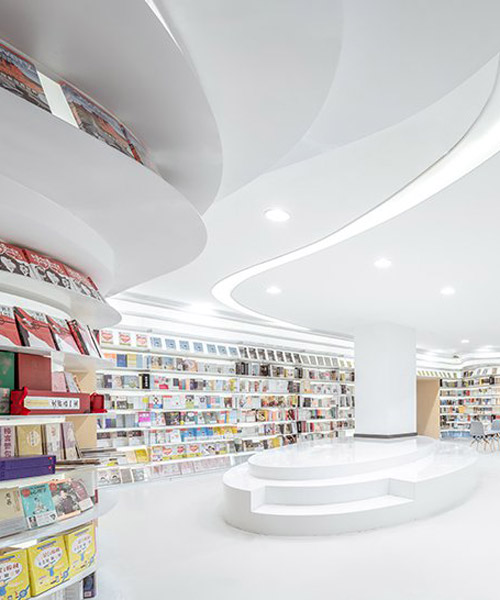 wutopia lab sets a white curved bookstore in xi'an, china