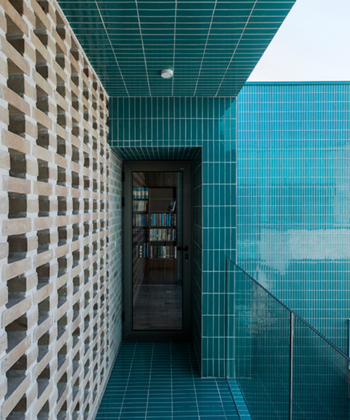 ayeneh office's house in iran takes shape around a central yard clad in blue tiles