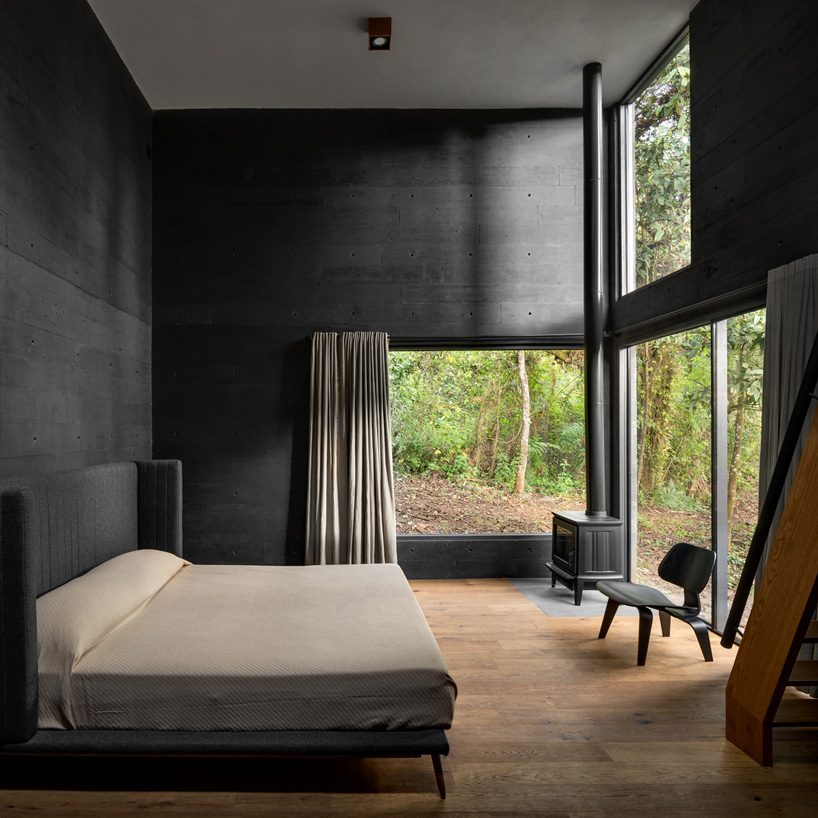 nine individual blocks compose the black concrete bruma house in mexico