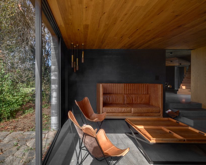 nine individual blocks compose the black concrete bruma house in mexico