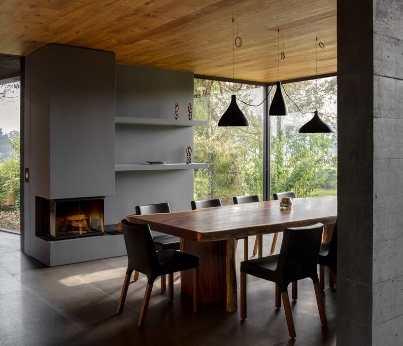 nine individual blocks compose the black concrete bruma house in mexico