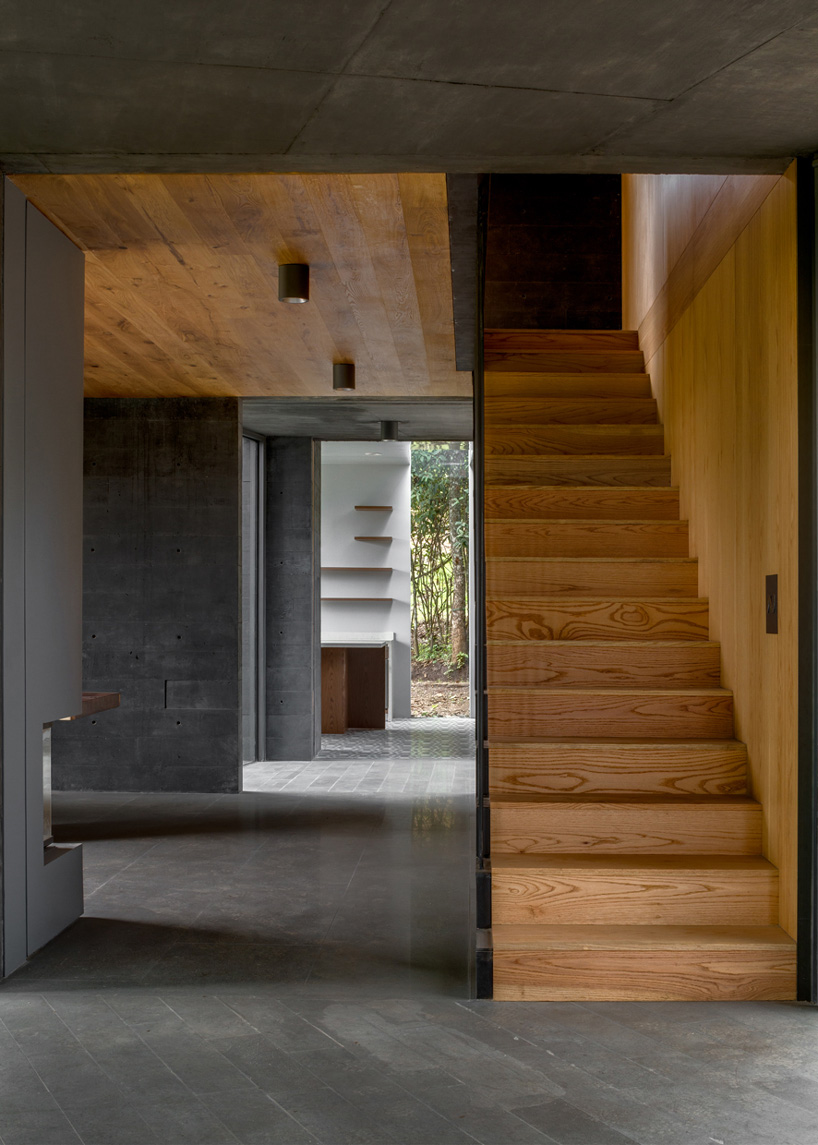 nine individual blocks compose the black concrete bruma house in mexico