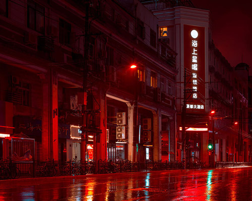 cody ellingham captures shanghai architecture rising up through red mist